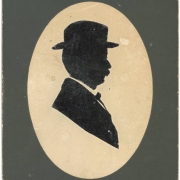 Silhouette cut-out profile of Colorado State Senator from Las Animas County, Casimiro Barela, He wears a hat and has a mustache.
