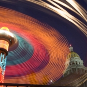 A time exposure captures the lights of the "Hurricane" ride on the mid-way set up on Broadway in front of the State Capitol on the third day of the four-day-long Taste of Colorado at Civic Center Park in downtown Denver on Sunday afternoon, Sept. 3, 20...