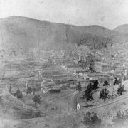 Bird's-eye view of Cripple Creek, Colorado after first fire on April 25, 1896; view possibly west of town taken from hillside near Midland Terminal Station; possibly Bennett Avenue area; many commercial business buildings still remain.