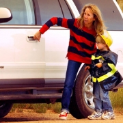 Margie Dleva gets son Spencer Delva into their van.