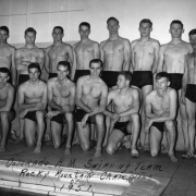 In Fort Collins, Larimer County, Colorado, the Colorado Agricultural and Mechanical College men's swim team poses in their trunks by an interior swimming pool. They are identified as: (L to R) (back) - Dick Conner - Russ Lawrence - Bill Evans (Capt.) - Carl Baily - Dick Benninghoven - Don Rupp - Jim Hurry - GW Tompkins (Tommy) coach (L to R) (front) - Gene Culver - Reyn Robertson - Jerry Darden - John Ehrenreich - Leon Schull - and John Emry."
