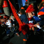 A man know as Rocky the Leprechaun, left, fires up over one hundred fans before they marched up and down the 16th Street Mall during a Kool 105 Parade to support the Denver Broncos in their game against the New England Patriots Saturday which will be t...