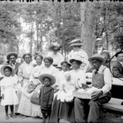Outdoor portrait of an African-American family preparing for a picnic in a park in Denver, Colorado.