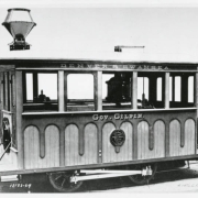 Photograph of the Denver Tramway street car for the Denver and Swansea line.  The words "Gov. (Governor) Gilpin" are written on the sides.  It was created as a test engine for a special day trip created by the Denver and South Park Railroads to Morrison, Colorado.  The  trip was by invitation only and included several former Denver City Mayors, Govenors and well known Coloradians.