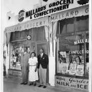 David and Virgina Mallard with man in front of Mallard's Grocery & Confectionery.
