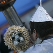 (BG206) Rambo, a schnauzer, dressed like the a lion is held by owner Fred Deichler, CQ, 26, who is dressed as the tin man at the first ever dog costume contest at the Flying Dog Tavern Tuesday, Oct. 31, 2006. All proceeds are to go to MaxFund, a non-pr...