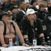 (BG1197} Denver Broncos Barrel Man hangs with a Oakland Raiders fans in the fourth quarter as the Broncos beat the Raiders 17-13 at McAfree Coliseum in Oakland, Ca., Sunday, Nov. 12, 2006. (BARRY GUTIERREZ/ROCKY MOUNTAIN NEWS) (((NAMES FROM OFFICIAL RO...