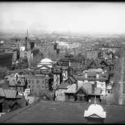 Right side of panorama view taken from Colorado State Capitol Building, Denver, Colorado; includes part of Capitol roof and turret, Sherman and Lincoln streets, corner of Y.M.C.A., and Trinity Church steeple. Signs read: "Hotel Metropole."