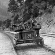 E. B. Allison operates Western Pacific track inspection motor car No. 26, in Feather River Canyon, California.