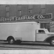 Delivery truck in front of Neiderhut Carriage Company building