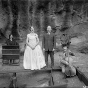 Men and women sing, play a portable piano and cello at the Garden of Angels (Red Rocks Amphitheater) near Morrison (Jefferson County), Colorado.