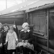 Outdoor portrait of girls and boys near Charles S. Lillybridge's house and studio in Denver, Colorado.