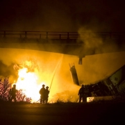 Photo by Dean Humphrey-- Grand Junction firefighters battle a tractor trailer crash in the westbound lanes of I-70 at the 26 1/2 Road overpass around 3:00 am today.  The highway and 26 1/2 road are closed indefinitely. The tractor was transporting 55 g...