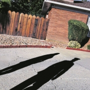 Major Steve Beck and another Marine approach the home of James Cathey.