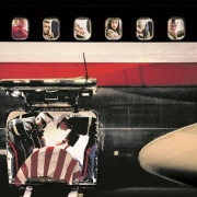 Marines drape the flag over the casket of 2nd Lt. James Cathey in an airliner's cargo hold.