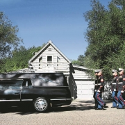 Marines escort the casket of Marine Lance Corporal Evenor Herrera to a gravesite in Eagle.