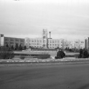 View of West High School, in Denver, Colorado; also shows a park with landscaping and letters in flowers: "Sunken Gardens."