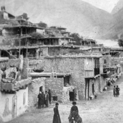 Photomechanical reproduction of a photograph by George Kennan shows multi-story buildings in Gimry, in the Untsukulsky District of the Republic of Dagestan, in Russia.