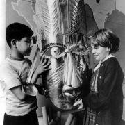 Mexican-Americans Michael Pando and Debbie Vigil pose with a tin mask at the Centro Cultural in Denver, Colorado.