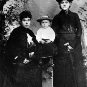 Studio portrait of Margaret "Molly" Tobin Brown, her son, Lawrence Palmer Brown, and her sister, Catherine Ellen "Hellen" Brown Benziger in Leadville, Colorado.