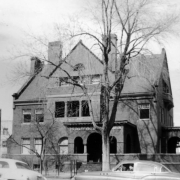 View on Sixteenth (16th) and Pennsylvania Streets, Denver, Colorado, shows a large brick house identified as having belonged to John Galen Lock. The sign over the door reads: "Colorado Educational Association."