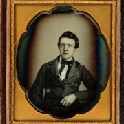 Studio portrait (sitting) of Benjamin McMakin of Philadelphia. He wears a suit and ascot tie.
