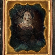 Portrait of Amanda Ermhorn [?] possibly the niece of R. Sopris. She wears a dress with a lace collar.