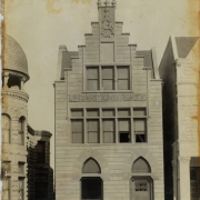 Presentation view of a residence at 1624 Washington Avenue in Denver, Colorado; architectural features include incised and stepped stone pediments, finials, and gothic arches.