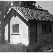 View of the water pump house in City Park near 23rd (Twenty-third) Avenue in Denver, Colorado. The building has a tile roof.