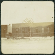View of a brick duplex home in Denver, Colorado.