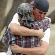 Two anguished students embrace near the school early in the siege.