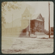 View of a church in Denver, Colorado. The building has a tower, arched windows, and rusticated brick accents.