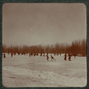 Familes ice skate on probably Duck Lake in City Park, Denver, Colorado.