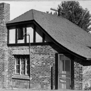 View of a brick building at the north gate to the Wellshire Golf Course (Wellshire Country Club) in Denver, Colorado.