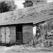 View of a water pump house at the Wellshire Golf Course (Wellshire Country Club) in Denver, Colorado. A sign that reads "Danger" is on a door of the building.