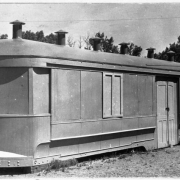 View of the puppet theater and woodworking shop at Rude Park Community Center at 1285 Decatur Street in Denver, Colorado. The building is a renovated railroad car.