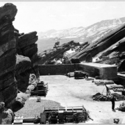 A side view of the stage and seating area at Red Rocks amphitheater under construction, Red Rocks Park, Morrison, Jefferson County, Colorado.