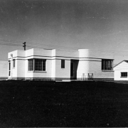View of a Moderne style house in Denver, Colorado. The one-story brick masonry house has art deco accents with ornate brick work.
