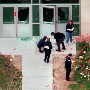 Investigators tackle the intricate task of marking evidence where gunmen entered the school.