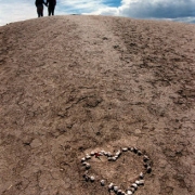 Joan and Bill Cote of Franktown climb a hill in Clement Park after visiting memorials to the Columbine victims.