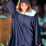 Columbine victim Valeen Schnurr acknowledges the cheers as she leaves the Fiddler's Green stage.
