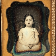 Sitting studio portrait of an unidentified girl.
