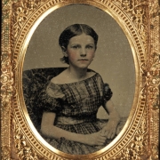 Sitting studio portrait of a girl identified as Grace Alice Stone French.