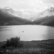 View of Trout Lake, in (probably) San Miguel County, Colorado; shows boats and surrounding mountain peaks.