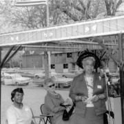 Dorothy Reeves gives a speech during the George Washington Carver Day Care Center dedication ceremony at 2260 Humboldt Street in the City Park West neighborhood of Denver, Colorado. Other women sit nearby and look on.