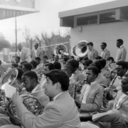 Members of a band play their instruments which include saxophones, baritones, and french horns, at the dedication of the George Washington Carver Day Nursery at 2260 Humboldt Street in the City Park West neighborhood of Denver, Colorado.