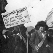 Women demonstrate to free Mother Jones and support the AMW Ludlow strike against CF&I, in Trinidad (Las Animas County), Colorado. They wear sashes that read: "Trinidad". One woman holds a sign that reads: "Mother Jones Has Not Done Anything That We Would Not Do".