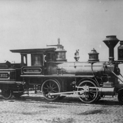 Photo of a photograph of a builder's view of Denver and Rio Grande Railroad locomotive number one; sign on the cab reads: "Montezuma."