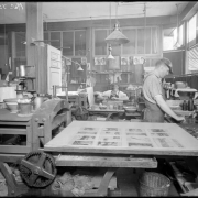 View of two printers working at the Smith-Brooks Printing Company in Denver, Colorado.