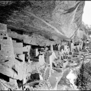 Cliff Palace, Mesa Verde National Park, Colorado. View from under  roof of cave of Native America (Anasazi) prehistoric cliff dwelling, a stone masonry structure with living quarters, storerooms, and kivas; shows snow on outside slope.